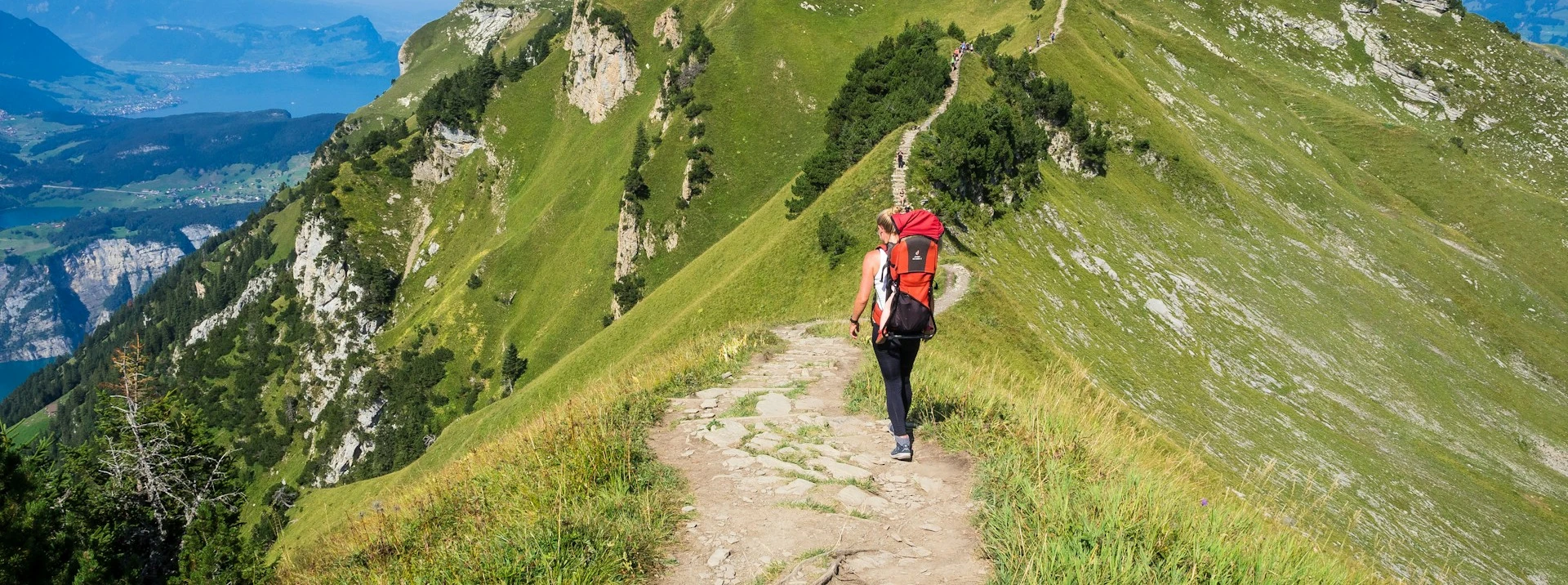 Hiker crossing rocky alpine stream — terrain the Keen Targhee III KEEN.DRY is built for